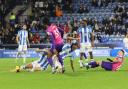Huddersfield's players slide in to win the ball during their 1-0 victory over Sunderland