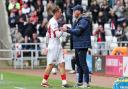 Mike Dodds embraces Jack Clarke after he's substituted in Sunderland's defeat to Sheffield Wednesday.
