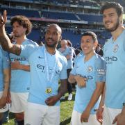 Ian Poveda (second right) during his time with Manchester City