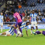 Huddersfield's players slide in to win the ball during their 1-0 victory over Sunderland